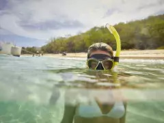 Woman snorkeling at Buck Island Turtle Beach 