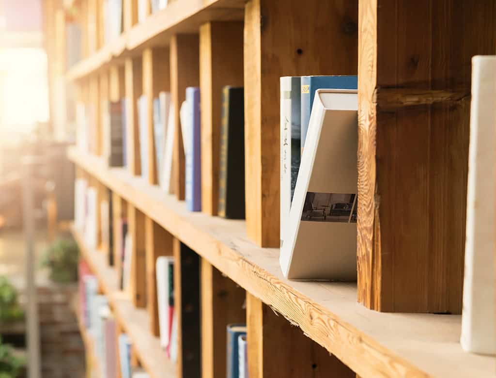 A wooden bookshelf glows in afternoon light at a bookstore in USVI
