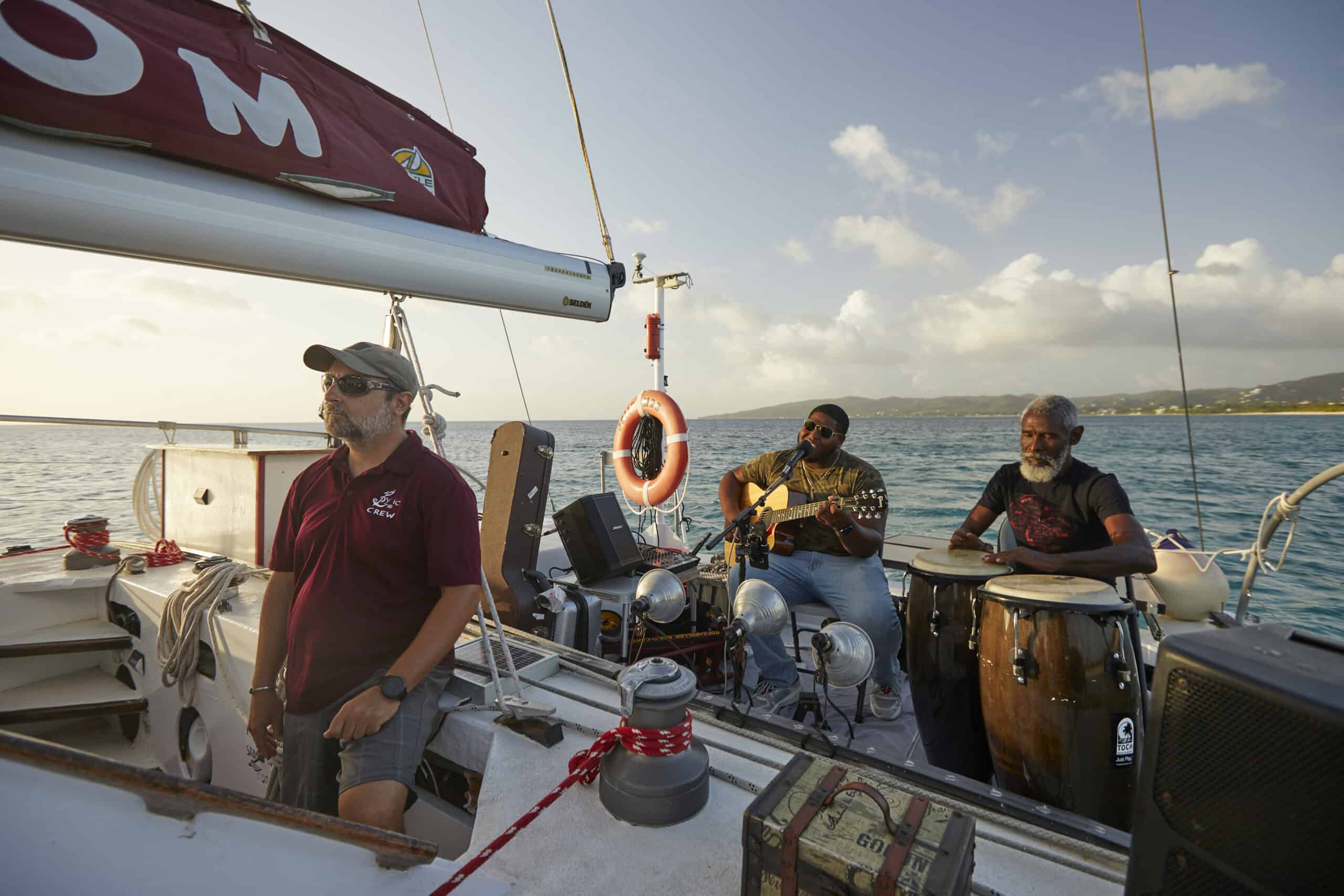Musicians play as captain guides the Lyric Sails excursion in St. Croix, USVI